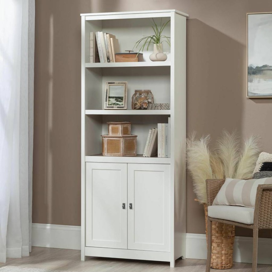 Sauder Cottage Road Library Bookcase with Doors, Adjustable Shelves and Storage in Raven Oak Finish